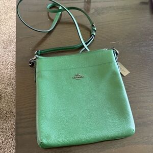 Coach Kitt Messenger Crossbody bag in green crossgrain leather.